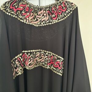 Elegant Black Dress with Red and Gold Detailing